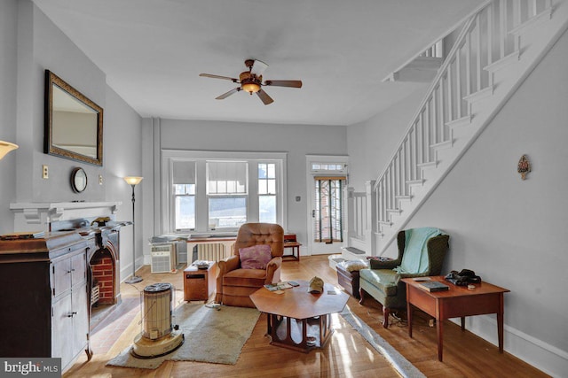 161 W High St, Womelsdorf, PA 19567 - living area featuring plenty of natural light, ceiling fan, wood finished floors, and stairway