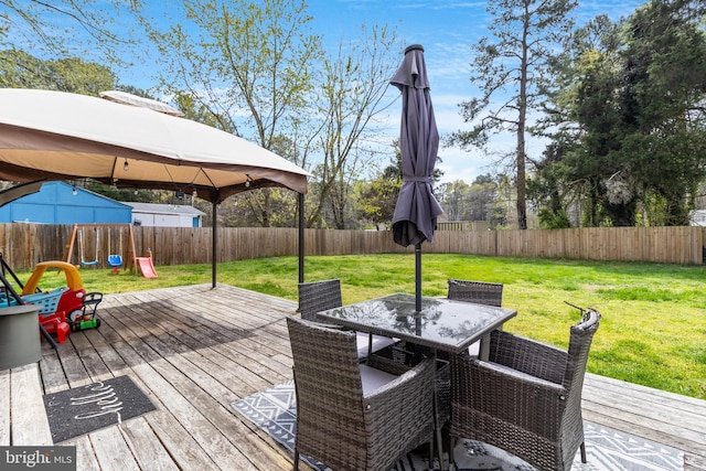 wooden terrace with a gazebo, a yard, and a playground