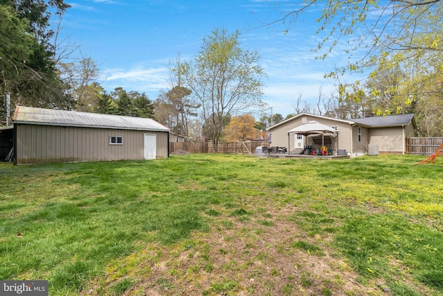 view of yard with an outbuilding and a patio