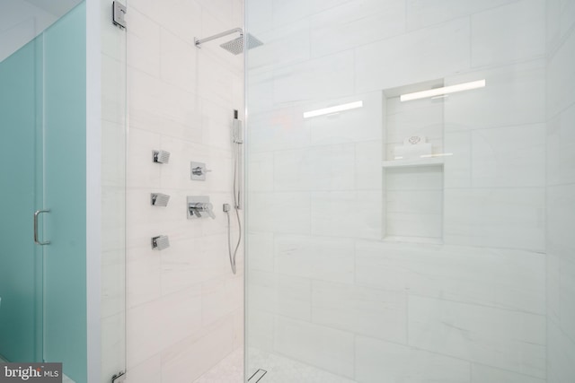 bathroom featuring an enclosed shower