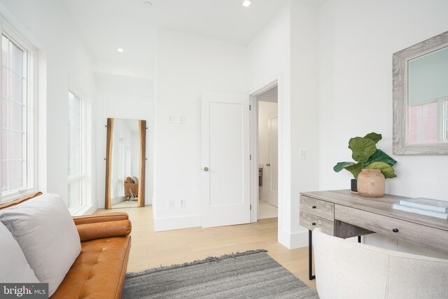 hallway with light hardwood / wood-style flooring