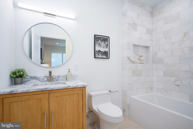 bathroom with a bath, toilet, and vanity