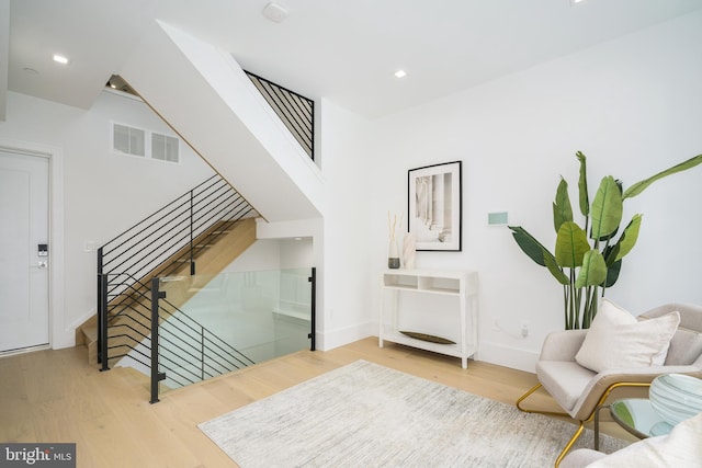 living area with light hardwood / wood-style flooring