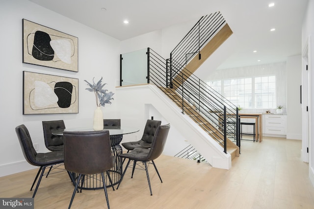 dining space featuring light wood-type flooring