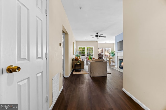 hall with dark hardwood / wood-style flooring