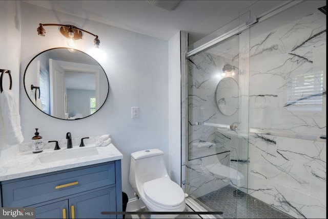 bathroom featuring walk in shower, vanity, and toilet