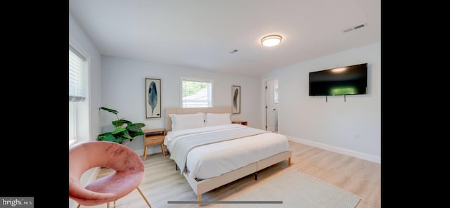 bedroom with light wood-type flooring