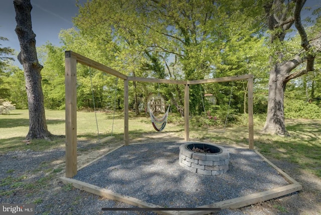 view of patio with a fire pit