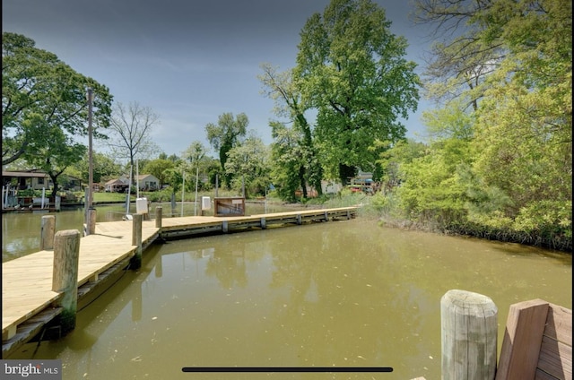 dock area featuring a water view