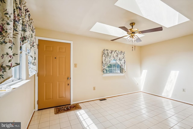 foyer entrance featuring ceiling fan and light tile patterned flooring