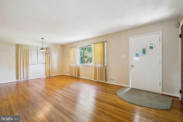 foyer entrance with light wood-type flooring