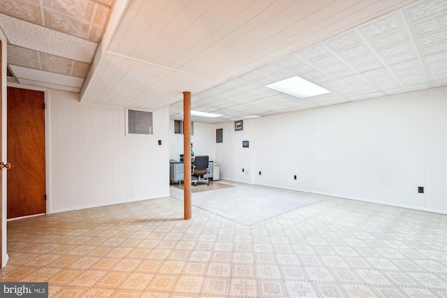 basement with wood walls