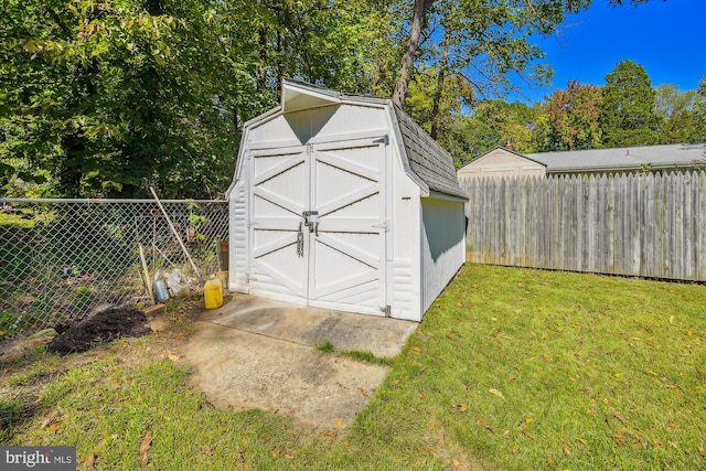 view of outbuilding featuring a yard