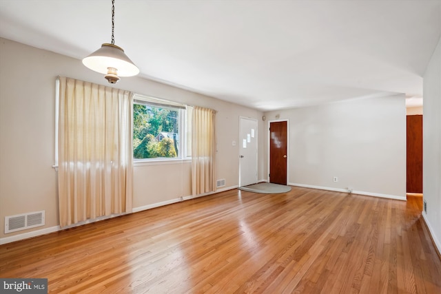 spare room featuring light wood-type flooring