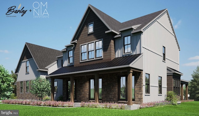 view of front of home with a shingled roof, metal roof, a standing seam roof, board and batten siding, and a front yard