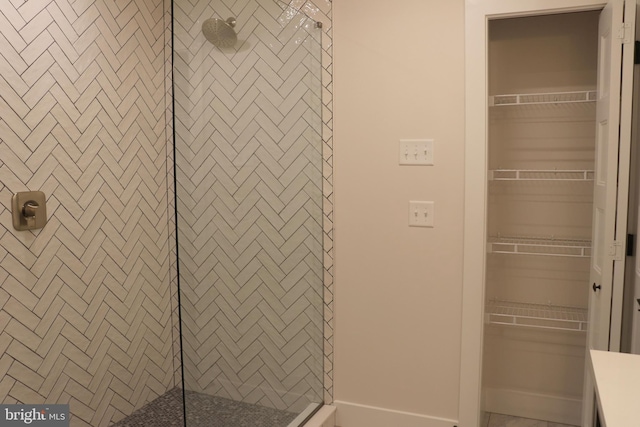 bathroom with tiled shower