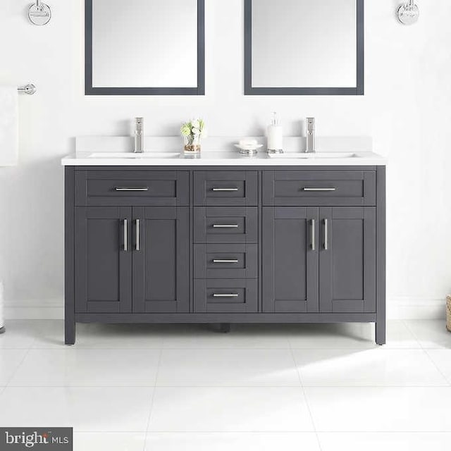 bathroom with tile patterned floors and vanity