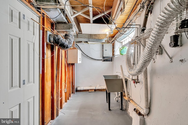 basement featuring electric panel