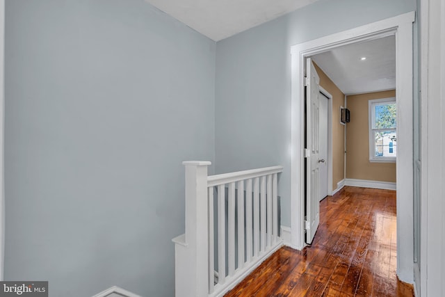 corridor with dark wood-type flooring