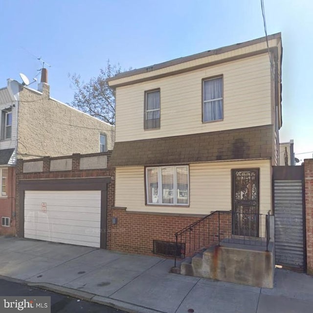 view of front of property with a garage