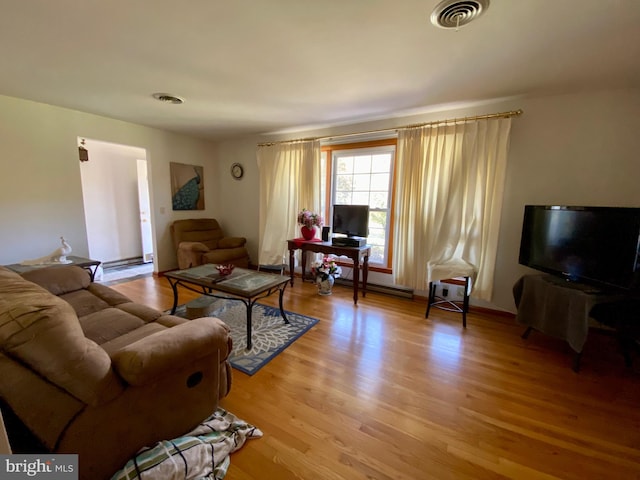 living room with light hardwood / wood-style floors