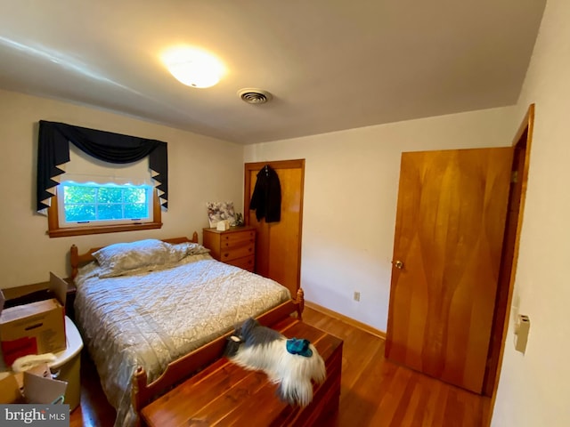 bedroom featuring wood-type flooring