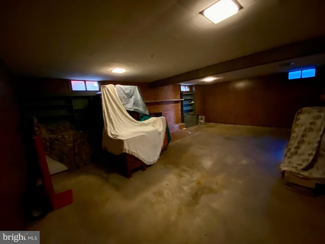 basement with a brick fireplace