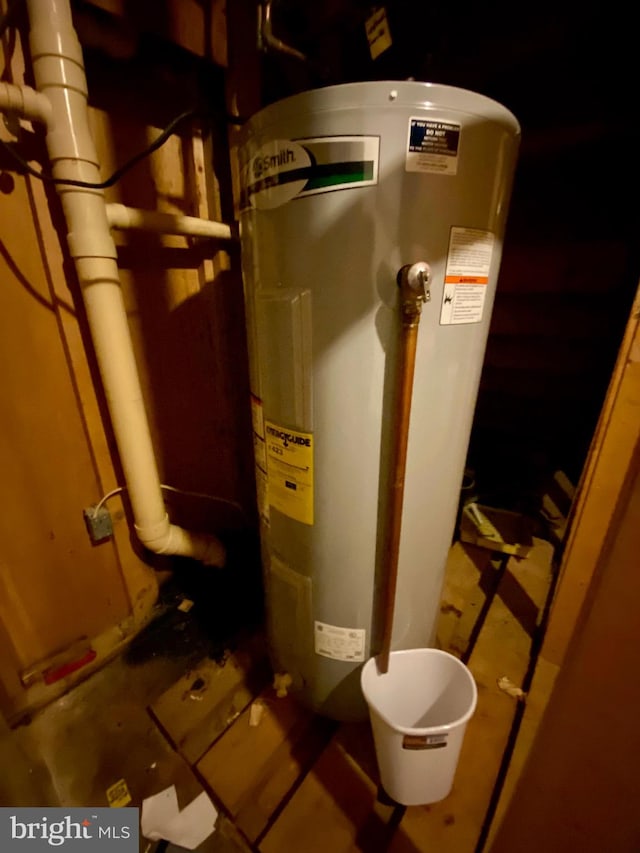 utility room with electric water heater