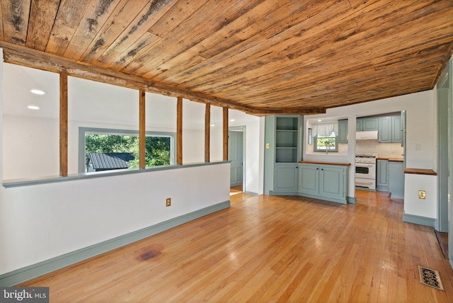 unfurnished living room featuring wooden ceiling and light hardwood / wood-style flooring