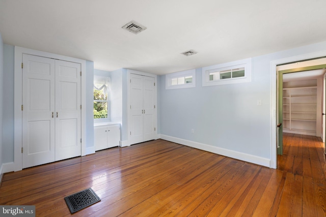 unfurnished bedroom featuring wood-type flooring