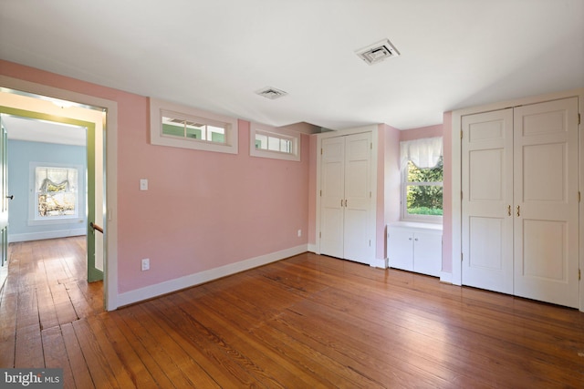 unfurnished bedroom featuring wood-type flooring