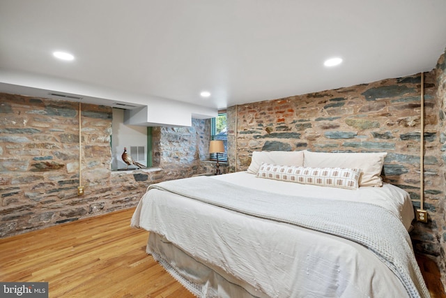 bedroom featuring visible vents, wood finished floors, and recessed lighting