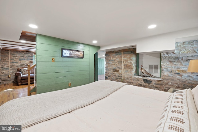 bedroom with hardwood / wood-style floors