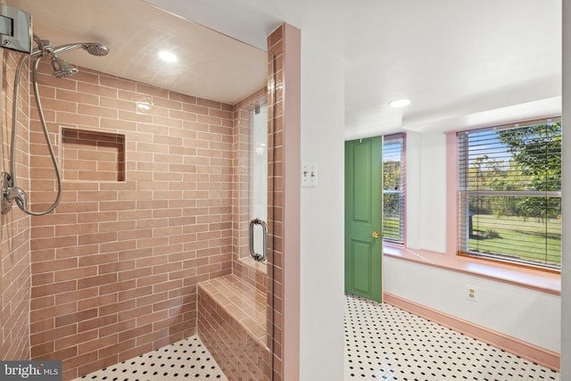 bathroom featuring baseboards, a shower stall, and recessed lighting