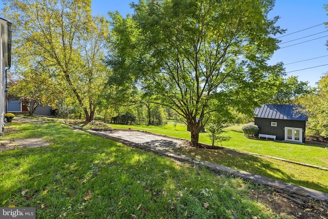 view of yard featuring french doors