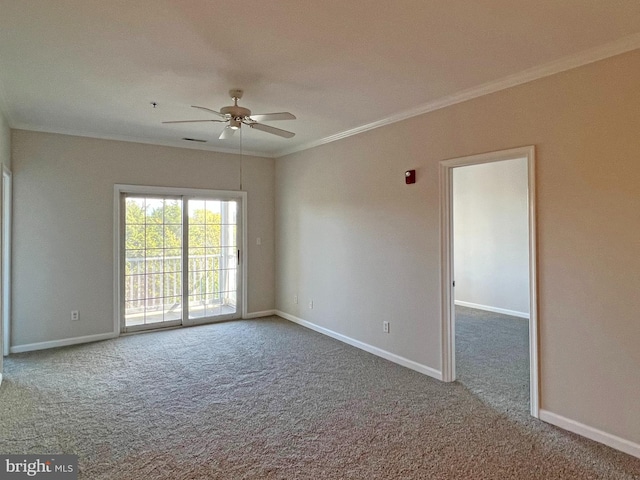 carpeted empty room with ceiling fan and crown molding