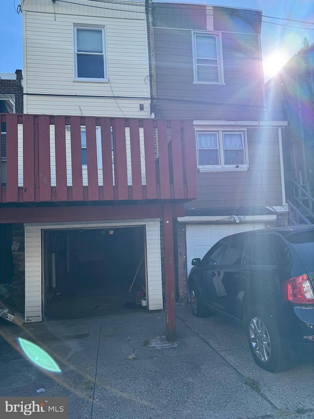 back of property featuring a garage