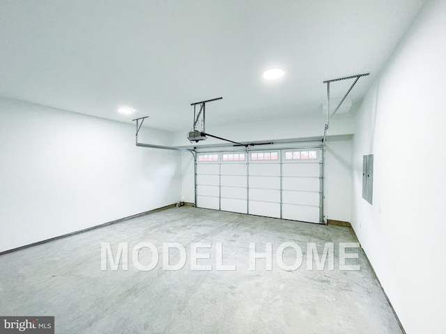 garage featuring recessed lighting, a garage door opener, and electric panel
