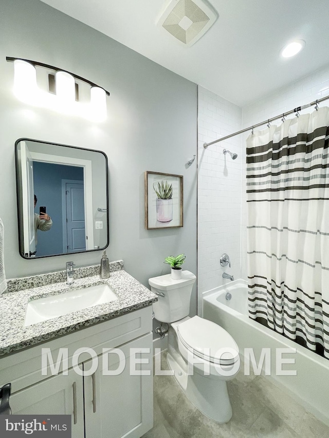 full bathroom featuring shower / bath combo, vanity, and toilet