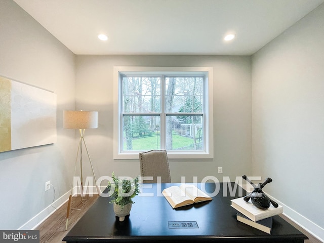 office area with wood-type flooring and a healthy amount of sunlight