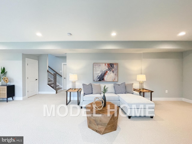 carpeted living area with recessed lighting, stairway, and baseboards