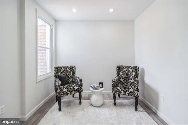 living area with hardwood / wood-style floors