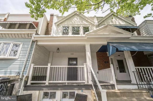 doorway to property with covered porch