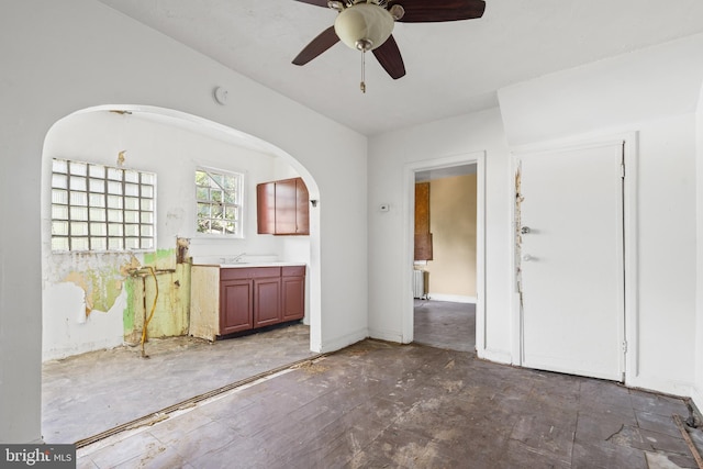 interior space with ceiling fan and radiator heating unit