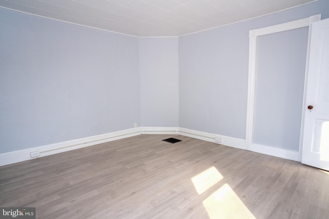 empty room featuring light hardwood / wood-style floors