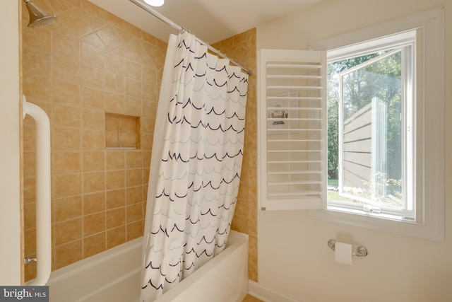 bathroom featuring shower / bath combo with shower curtain