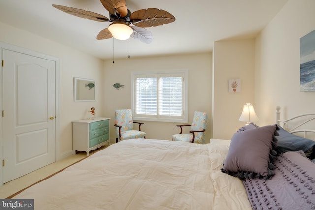 bedroom with ceiling fan and carpet floors