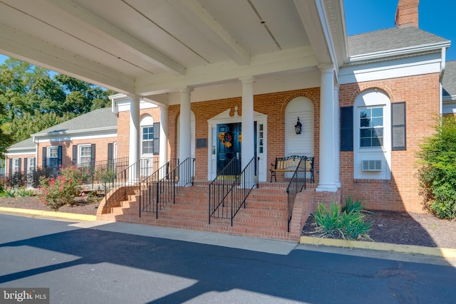 property entrance featuring covered porch