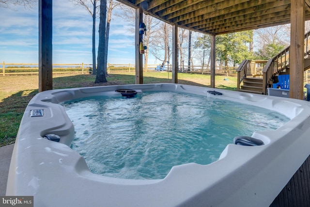 view of swimming pool featuring a wooden deck and a hot tub