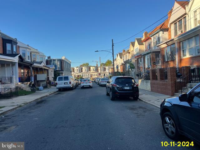 5426 Trinity St, Philadelphia, PA 19143 - view of street with street lighting, sidewalks, a residential view, and curbs